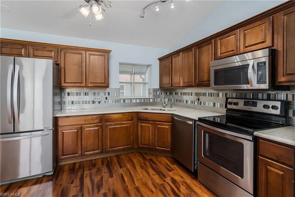 Updated kitchen with stainless appliances and wood cabinetry